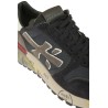 Calzature sneaker realizzata in camoscio e tessuto con inserti in pelle suola gomma